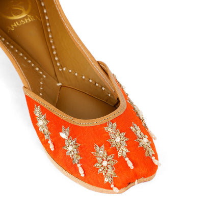 Saffron orange embellished ethnic flats for women – lifestyle view