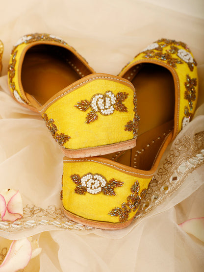 Sunshine yellow embellished ethnic flats for women – top product view