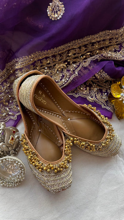 Jhanjharia gold embellished ethnic flats for women – top product view
